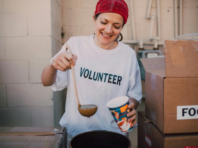 Help others to spread some holiday cheer Photo by RDNE Stock project: https://www.pexels.com/photo/a-woman-in-white-shirt-standing-beside-cardboard-boxes-6646981/